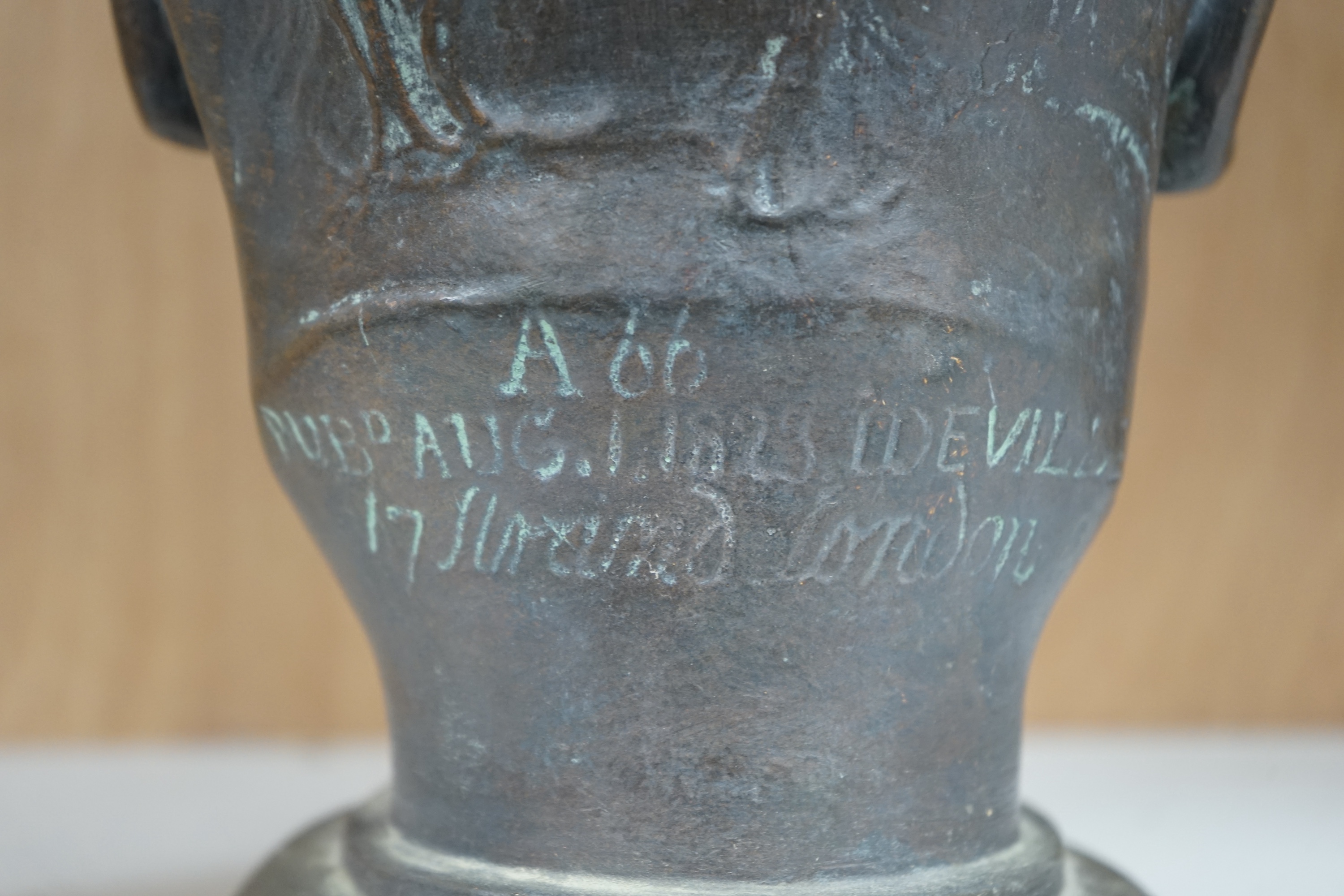 After James Deville, a bronzed plaster bust of William Blake, 28cm high. Condition - bronzed paint scratch to nose showing plaster